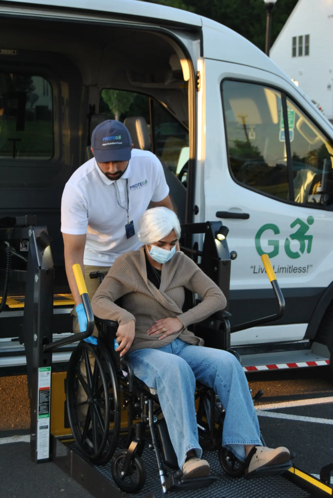 Protego Transport aide helping a woman in a wheelchair onto a van lift for dialysis transportation in Fairfaxwheelchair-dialysis-transportation-fairfax